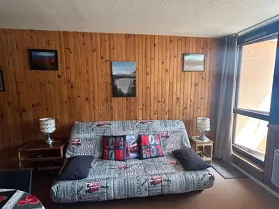 Coin salon dans l'établissement Appartement au pied des pistes à Super Besse - FR-1-814-61