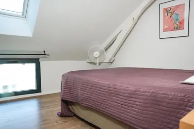 Un ou plusieurs lits dans un hébergement de l'établissement Coeur de village, maison pour 8 avec piscine