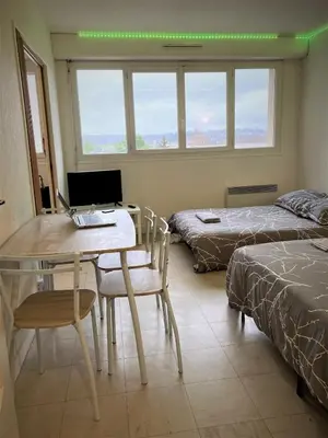 Un ou plusieurs lits dans un hébergement de l'établissement Appartement double à LIMOGES