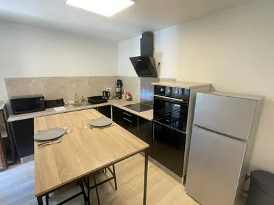 Cuisine ou kitchenette dans l'établissement Le Briand