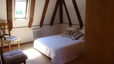 Un ou plusieurs lits dans un hébergement de l'établissement Gîte de l'Abreuvoir
