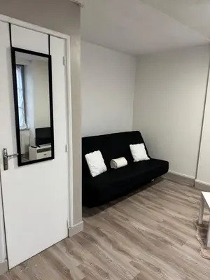 Coin salon dans l'établissement Appartement plein centre