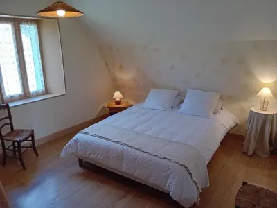 Un ou plusieurs lits dans un hébergement de l'établissement Maison de charme à la campagne