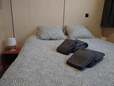 Un ou plusieurs lits dans un hébergement de l'établissement Chalet Le Côme