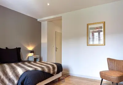Un ou plusieurs lits dans un hébergement de l'établissement Villa de 150m2, 4 ch, 4 SDB, Wifi, Patio, Vallée de la Jordanne