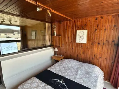 Un ou plusieurs lits dans un hébergement de l'établissement Appartement confortable 6 pers au centre de Super Besse - FR-1-814-84