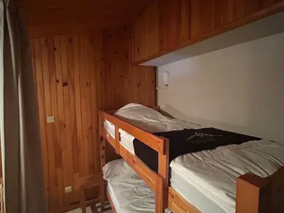 Un ou plusieurs lits dans un hébergement de l'établissement Appartement duplex 4 pers, centre station, garage privé - FR-1-814-82