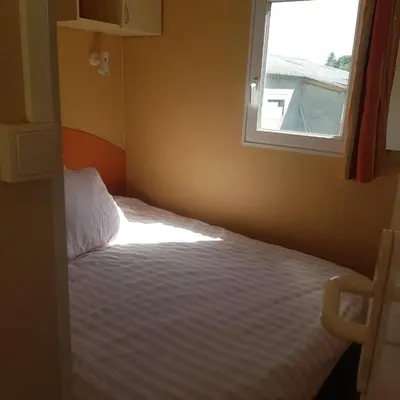 Un ou plusieurs lits dans un hébergement de l'établissement Mobilhome with terrace