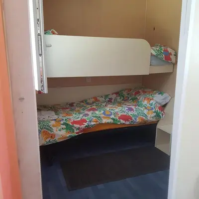 Un ou plusieurs lits dans un hébergement de l'établissement Mobilhome with terrace