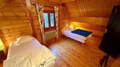 Un ou plusieurs lits dans un hébergement de l'établissement Chalet Ô Mont Dore