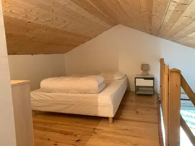 Un ou plusieurs lits dans un hébergement de l'établissement Gîte cocon Vassivière Aux abords du lac