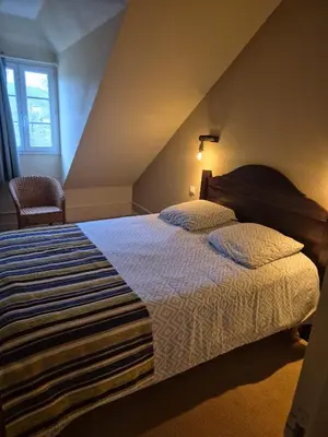 Un ou plusieurs lits dans un hébergement de l'établissement Charmant Duplex en bord de Dordogne - Argentat- Corrèze