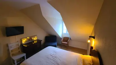 Un ou plusieurs lits dans un hébergement de l'établissement Charmant Duplex en bord de Dordogne - Argentat- Corrèze