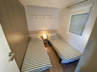 Un ou plusieurs lits dans un hébergement de l'établissement Camping 3 étoiles - ccaidff