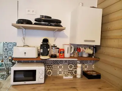 Cuisine ou kitchenette dans l'établissement Studio en montagne