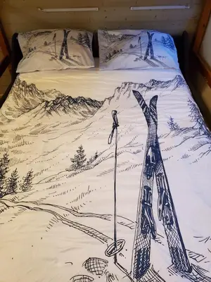 Un ou plusieurs lits dans un hébergement de l'établissement Studio en montagne