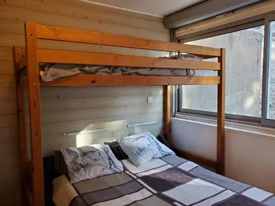 Un ou plusieurs lits dans un hébergement de l'établissement Super-Besse - studio 800m des pistes
