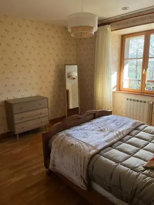 Un ou plusieurs lits dans un hébergement de l'établissement Gîte 6 personnes Chez Gaby