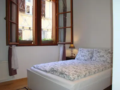 Un ou plusieurs lits dans un hébergement de l'établissement Beaulieu Apartments
