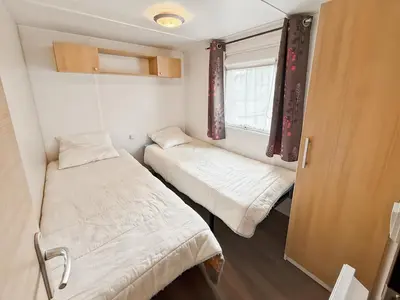Un ou plusieurs lits dans un hébergement de l'établissement Mobil-home Le Sorbier, 6pers
