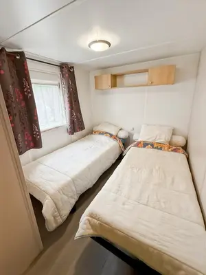 Un ou plusieurs lits dans un hébergement de l'établissement Mobil-home Le Sorbier, 6pers
