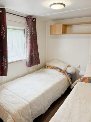 Un ou plusieurs lits dans un hébergement de l'établissement Mobil-home Le Sorbier, 6pers