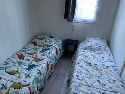 Un ou plusieurs lits dans un hébergement de l'établissement Chalet n 21
