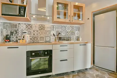 Cuisine ou kitchenette dans l'établissement Le Pianiste, en hypercentre avec balcon