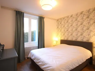 Un ou plusieurs lits dans un hébergement de l'établissement Appart T3 lumineux, 5 pers, jardin, wifi, La Bourboule - FR-1-608-283