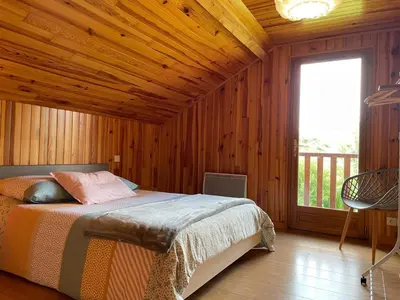 Un ou plusieurs lits dans un hébergement de l'établissement Chalet Enchante Nature