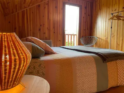 Un ou plusieurs lits dans un hébergement de l'établissement Chalet Enchante Nature