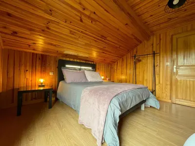 Un ou plusieurs lits dans un hébergement de l'établissement Chalet Enchante Nature