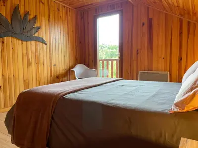 Un ou plusieurs lits dans un hébergement de l'établissement Chalet Enchante Nature