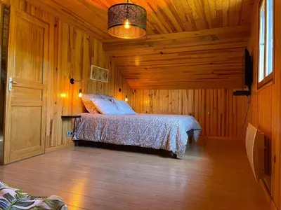 Un ou plusieurs lits dans un hébergement de l'établissement Chalet Enchante Nature