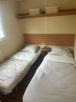 Un ou plusieurs lits dans un hébergement de l'établissement Mobile home