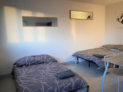 Un ou plusieurs lits dans un hébergement de l'établissement Appartement double à Limoges