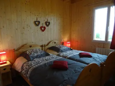 Un ou plusieurs lits dans un hébergement de l'établissement Chalet Chez Picou