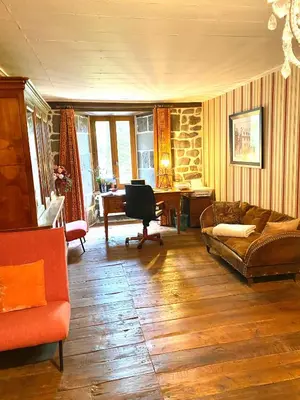 Coin salon dans l'établissement Chambre avec du charme
