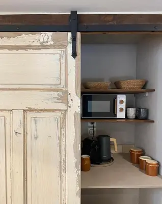 Cuisine ou kitchenette dans l'établissement Maison Honorine