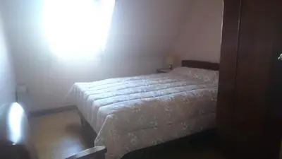 Un ou plusieurs lits dans un hébergement de l'établissement Maison récente type traditionnelle 9 couchages