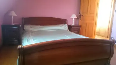 Un ou plusieurs lits dans un hébergement de l'établissement Maison récente type traditionnelle 9 couchages