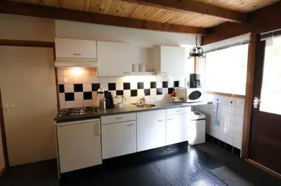 Cuisine ou kitchenette dans l'établissement Trésors de Lilain