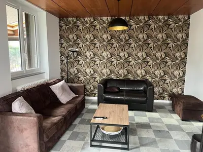 Coin salon dans l'établissement Grand Gîte le Skieur à Besse