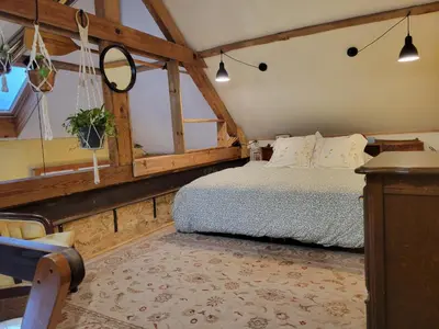 Un ou plusieurs lits dans un hébergement de l'établissement Loft Apartment at Moulin SAGE
