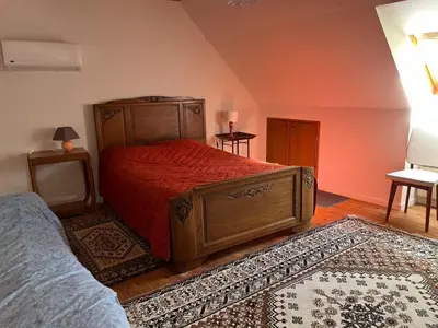 Un ou plusieurs lits dans un hébergement de l'établissement La Maison bleue