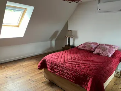 Un ou plusieurs lits dans un hébergement de l'établissement La Maison bleue