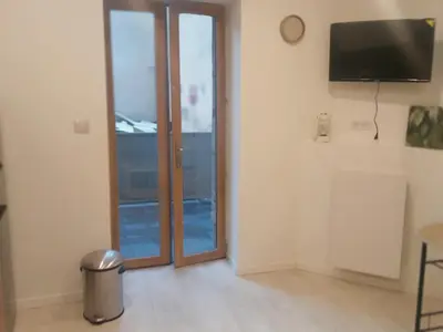 Télévision ou salle de divertissement dans l'établissement Sasha
