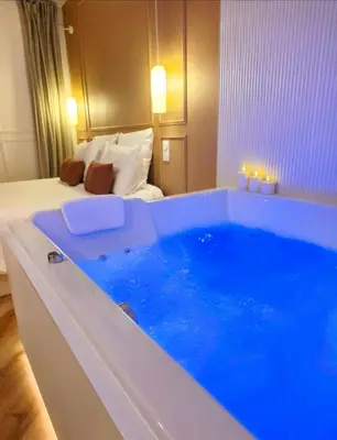 Un ou plusieurs lits dans un hébergement de l'établissement Le Boudoir d'Elba - Balneotherapie & terrasse