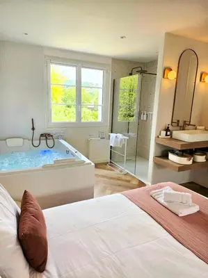 Un ou plusieurs lits dans un hébergement de l'établissement Le Boudoir d'Elba - Balneotherapie & terrasse