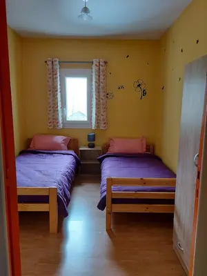 Un ou plusieurs lits dans un hébergement de l'établissement Maison au pied du puy mary
